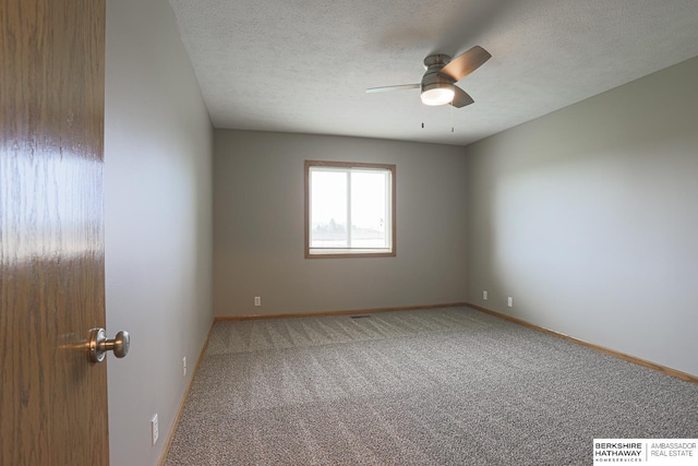 32 Huron Cir, Council Bluffs, IA 51501 - spare room with carpet flooring, a ceiling fan, and a textured ceiling