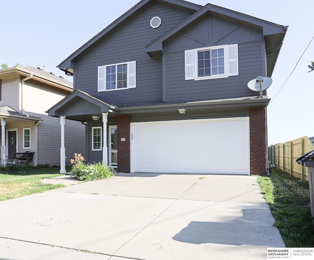 32 Huron Cir, Council Bluffs, IA 51501 - view of front of home featuring brick siding, a garage, and driveway