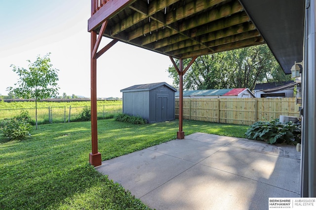 32 Huron Cir, Council Bluffs, IA 51501 - fenced backyard featuring a patio and a storage shed