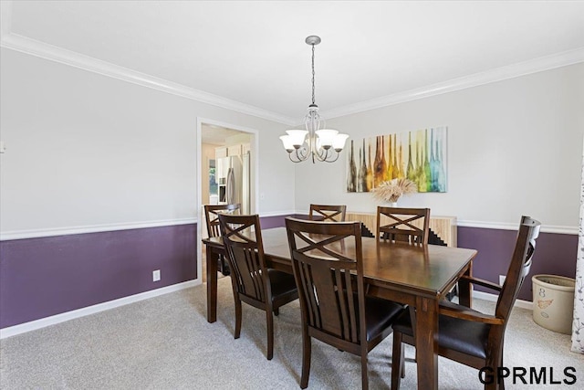 16404 Polk St, Omaha, NE 68135 - dining room with crown molding, a chandelier, and light colored carpet