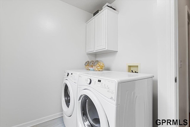 16404 Polk St, Omaha, NE 68135 - washroom featuring washing machine and clothes dryer and cabinet space