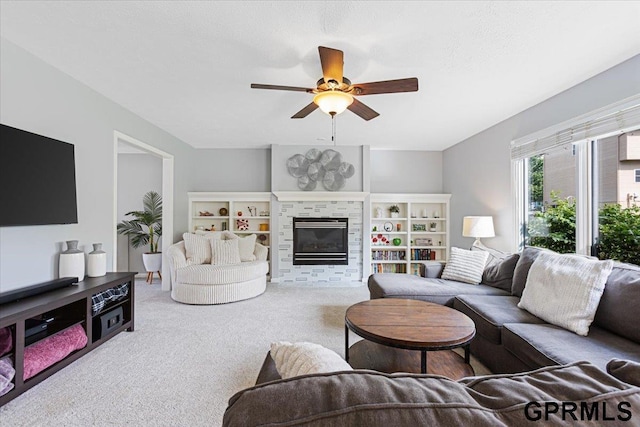 16404 Polk St, Omaha, NE 68135 - carpeted living area with a ceiling fan and a stone fireplace