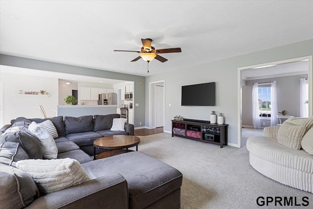 16404 Polk St, Omaha, NE 68135 - living room featuring a ceiling fan and light colored carpet