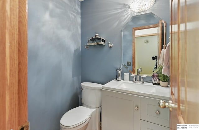 1326 Bellevue Blvd, Bellevue, NE 68005 - half bathroom featuring vanity and toilet