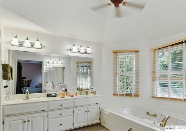 1326 Bellevue Blvd, Bellevue, NE 68005 - bathroom with plenty of natural light, double vanity, a bath, ceiling fan, and lofted ceiling