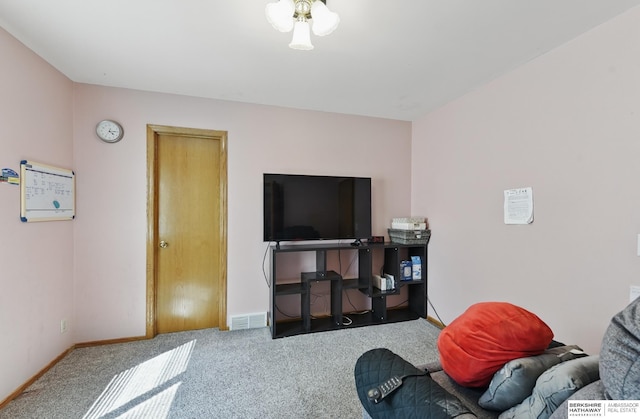 1326 Bellevue Blvd, Bellevue, NE 68005 - living room featuring carpet flooring and baseboards