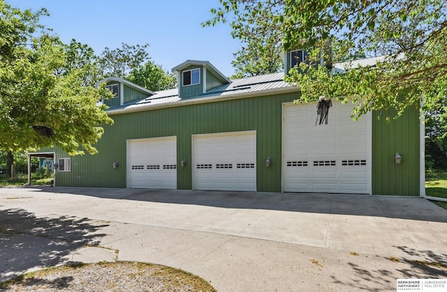 1326 Bellevue Blvd, Bellevue, NE 68005 - view of property exterior with a metal roof and a detached garage