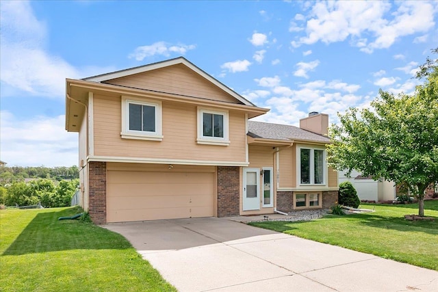 10011 S 9th Cir, Bellevue, NE 68123 - split level home featuring brick siding, a garage, a chimney, driveway, and a front lawn