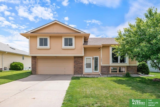 10011 S 9th Cir, Bellevue, NE 68123 - split level home with brick siding, a garage, driveway, and a front yard