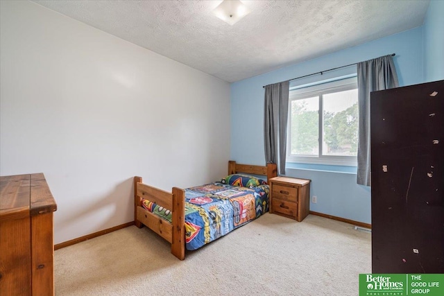10011 S 9th Cir, Bellevue, NE 68123 - bedroom featuring carpet floors and a textured ceiling