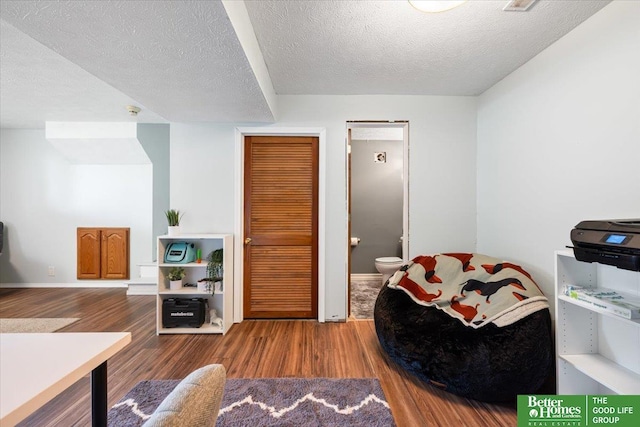 10011 S 9th Cir, Bellevue, NE 68123 - interior space featuring wood finished floors and a textured ceiling