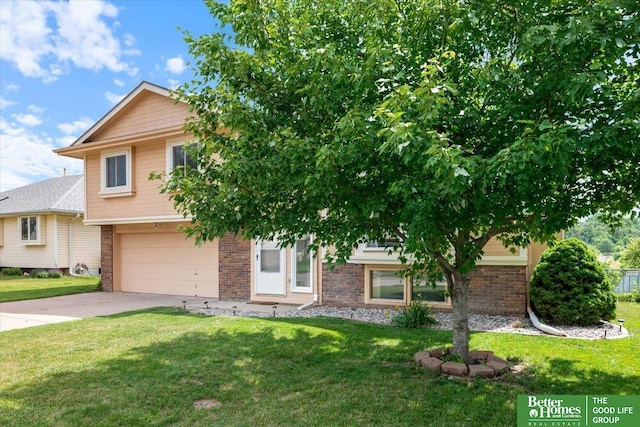 10011 S 9th Cir, Bellevue, NE 68123 - view of front of home with a garage, brick siding, driveway, and a front yard