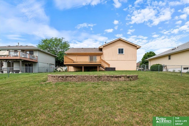 10011 S 9th Cir, Bellevue, NE 68123 - rear view of house with a fenced backyard, a wooden deck, and stairs