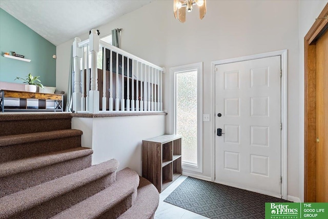 10011 S 9th Cir, Bellevue, NE 68123 - foyer featuring stairway and vaulted ceiling