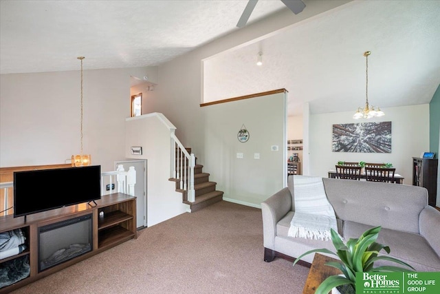 10011 S 9th Cir, Bellevue, NE 68123 - living room with a chandelier, vaulted ceiling, carpet flooring, stairs, and ceiling fan