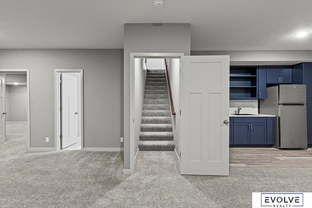 12040 S 44th St, Bellevue, NE 68123 - staircase featuring carpet flooring and baseboards