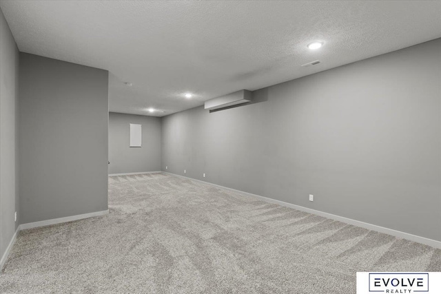 12040 S 44th St, Bellevue, NE 68123 - finished below grade area featuring carpet flooring, a textured ceiling, and recessed lighting