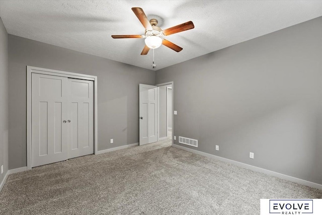 12040 S 44th St, Bellevue, NE 68123 - unfurnished bedroom with carpet floors, a closet, a textured ceiling, and ceiling fan