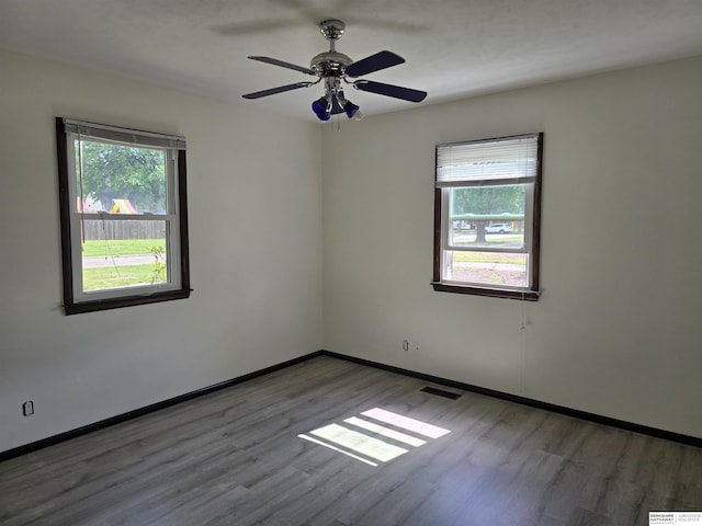 6925 Kearney Ave, Lincoln, NE 68507 - unfurnished room featuring wood finished floors and a ceiling fan