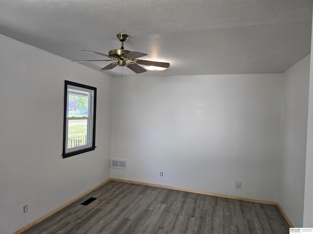 6925 Kearney Ave, Lincoln, NE 68507 - unfurnished room with wood finished floors and ceiling fan