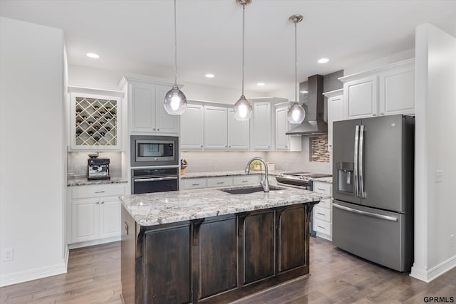 2111 Gindy Dr, Bellevue, NE 68147 - kitchen featuring stainless steel appliances, wall chimney range hood, white cabinetry, dark wood-style flooring, and recessed lighting