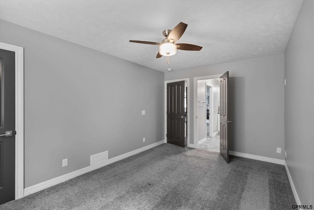 2111 Gindy Dr, Bellevue, NE 68147 - unfurnished bedroom featuring carpet flooring, a textured ceiling, and ceiling fan