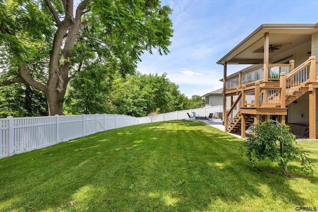 2111 Gindy Dr, Bellevue, NE 68147 - fenced backyard with ceiling fan, stairs, a patio area, and a wooden deck