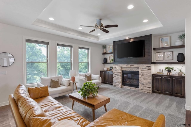 2111 Gindy Dr, Bellevue, NE 68147 - living room with a tray ceiling, a ceiling fan, a fireplace, ornamental molding, and recessed lighting