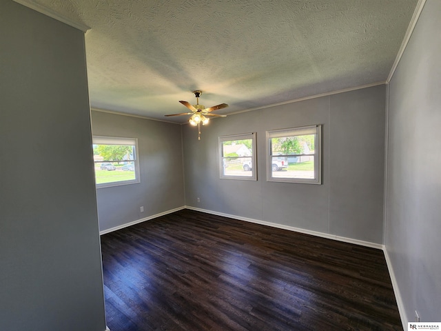 1653 E 3rd St, Fremont, NE 68025 - unfurnished room featuring crown molding, dark wood-type flooring, a textured ceiling, and a ceiling fan