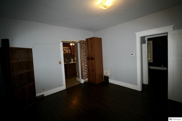 315 N Main St, Wilber, NE 68465 - unfurnished bedroom with wood finished floors and baseboards