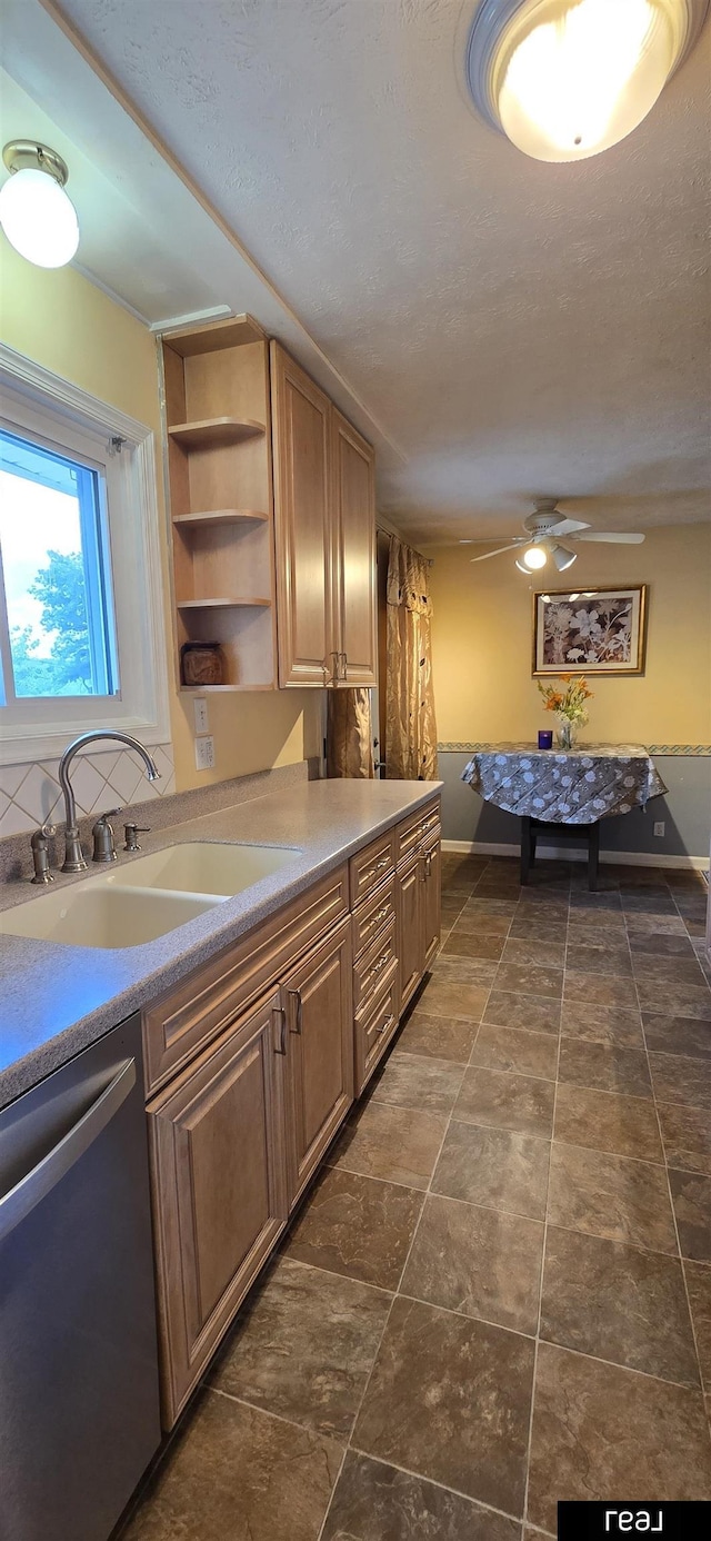7512 Susan Ave S, La Vista, NE 68128 - kitchen with stainless steel dishwasher, open shelves, ceiling fan, and light countertops