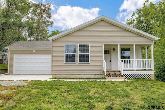 2507 Murray Rd, Plattsmouth, NE 68048 - view of front of home with a porch, an attached garage, a front lawn, and driveway