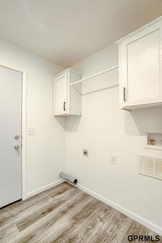 2507 Murray Rd, Plattsmouth, NE 68048 - washroom with cabinet space, light wood-style floors, electric dryer hookup, and hookup for a washing machine