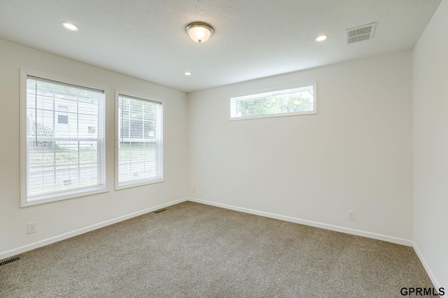 2507 Murray Rd, Plattsmouth, NE 68048 - carpeted empty room with recessed lighting