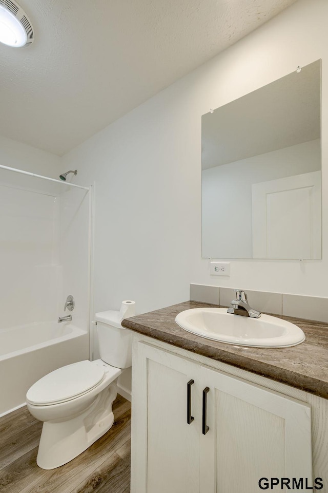 2507 Murray Rd, Plattsmouth, NE 68048 - bathroom with vanity, wood finished floors, and bathtub / shower combination