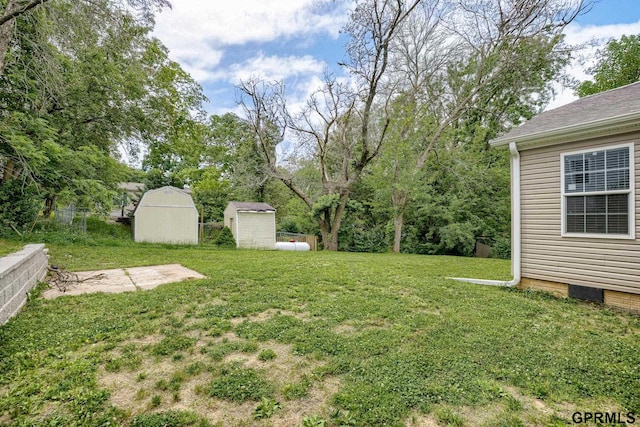 2507 Murray Rd, Plattsmouth, NE 68048 - view of grassy yard featuring a storage shed
