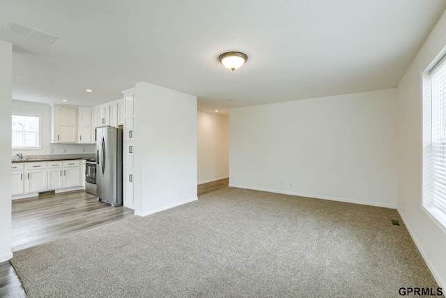 2507 Murray Rd, Plattsmouth, NE 68048 - unfurnished living room with recessed lighting and light colored carpet
