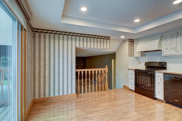 2530 S 148th St, Omaha, NE 68144 - kitchen featuring black appliances, premium range hood, light countertops, recessed lighting, and light wood finished floors