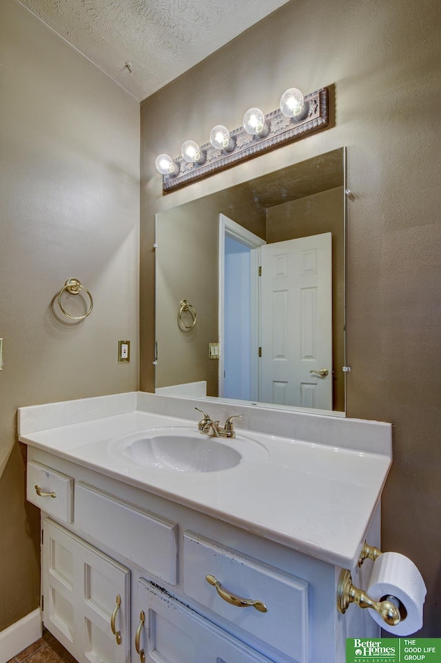 2530 S 148th St, Omaha, NE 68144 - bathroom with vanity and a textured ceiling