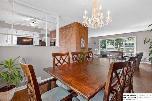 247 N 117th Ave, Omaha, NE 68154 - dining space with wood finished floors, a ceiling fan, and a chandelier