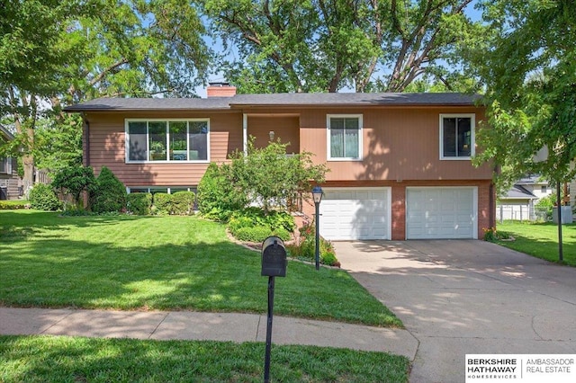 247 N 117th Ave, Omaha, NE 68154 - view of front of property featuring a garage, driveway, a front lawn, and a chimney