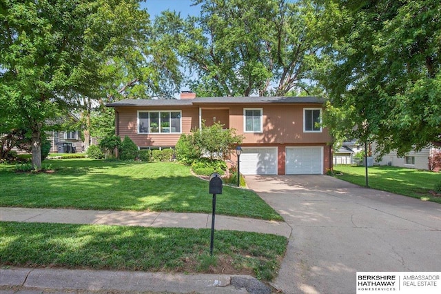 247 N 117th Ave, Omaha, NE 68154 - ranch-style home featuring a garage, driveway, a front yard, and a chimney