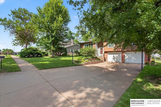 247 N 117th Ave, Omaha, NE 68154 - view of front of property featuring driveway, a front lawn, an attached garage, and stucco siding
