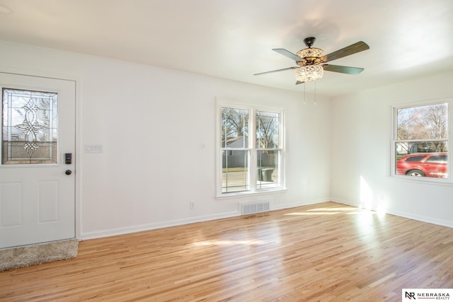 3772 F St, Lincoln, NE 68510 - entrance foyer featuring light wood-type flooring and ceiling fan