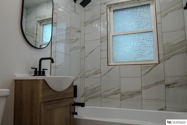 3772 F St, Lincoln, NE 68510 - bathroom featuring bathing tub / shower combination and vanity