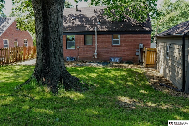 3772 F St, Lincoln, NE 68510 - back of property featuring brick siding and a shingled roof