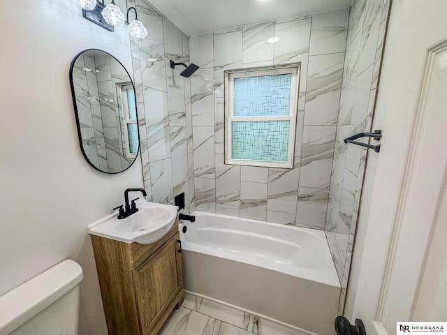 3772 F St, Lincoln, NE 68510 - bathroom with vanity, shower / bath combination, and marble look tile flooring