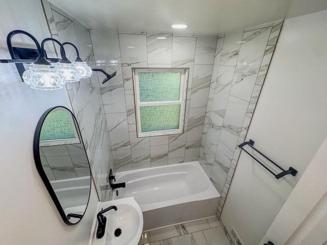 3772 F St, Lincoln, NE 68510 - full bath featuring marble look tiles and shower / washtub combination
