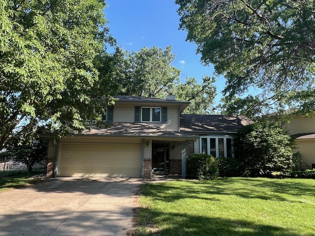 6211 S 150th St, Omaha, NE 68137 - view of front of house featuring brick siding, concrete driveway, a front lawn, and a chimney