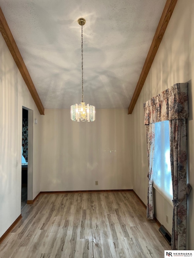 6211 S 150th St, Omaha, NE 68137 - unfurnished dining area featuring wood finished floors and a chandelier